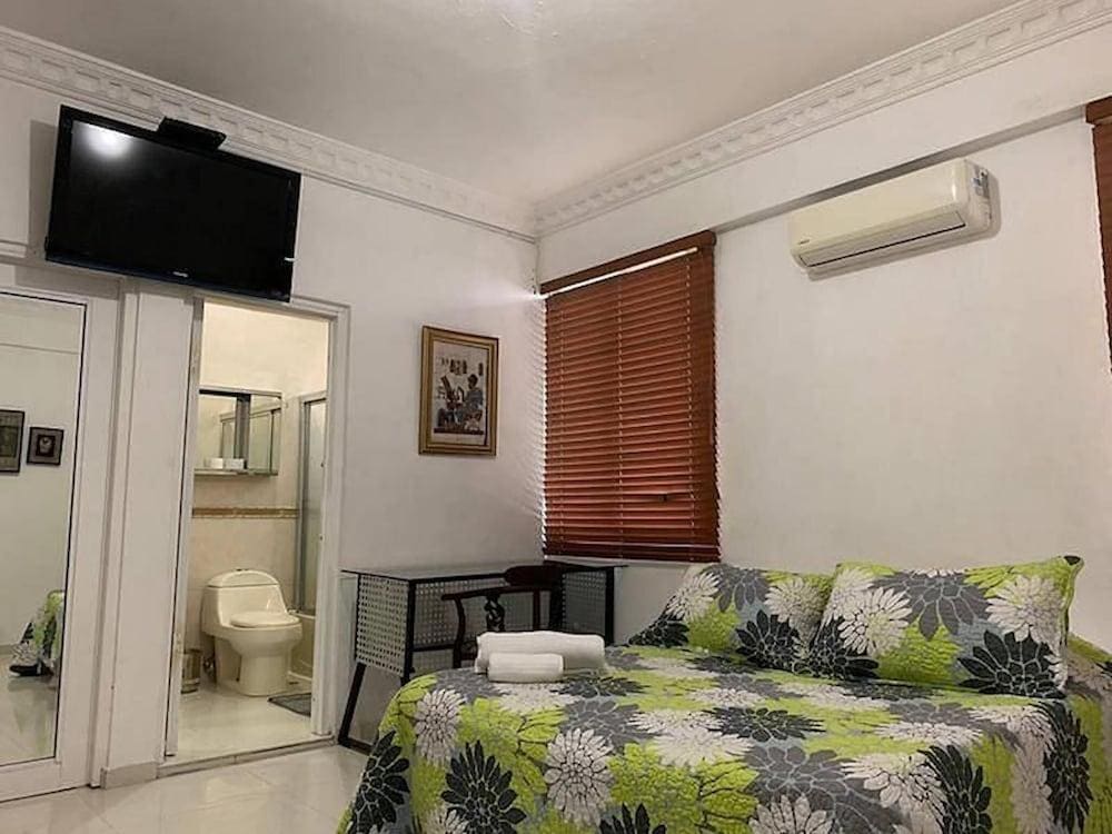 Malecon Rooms & Hotel